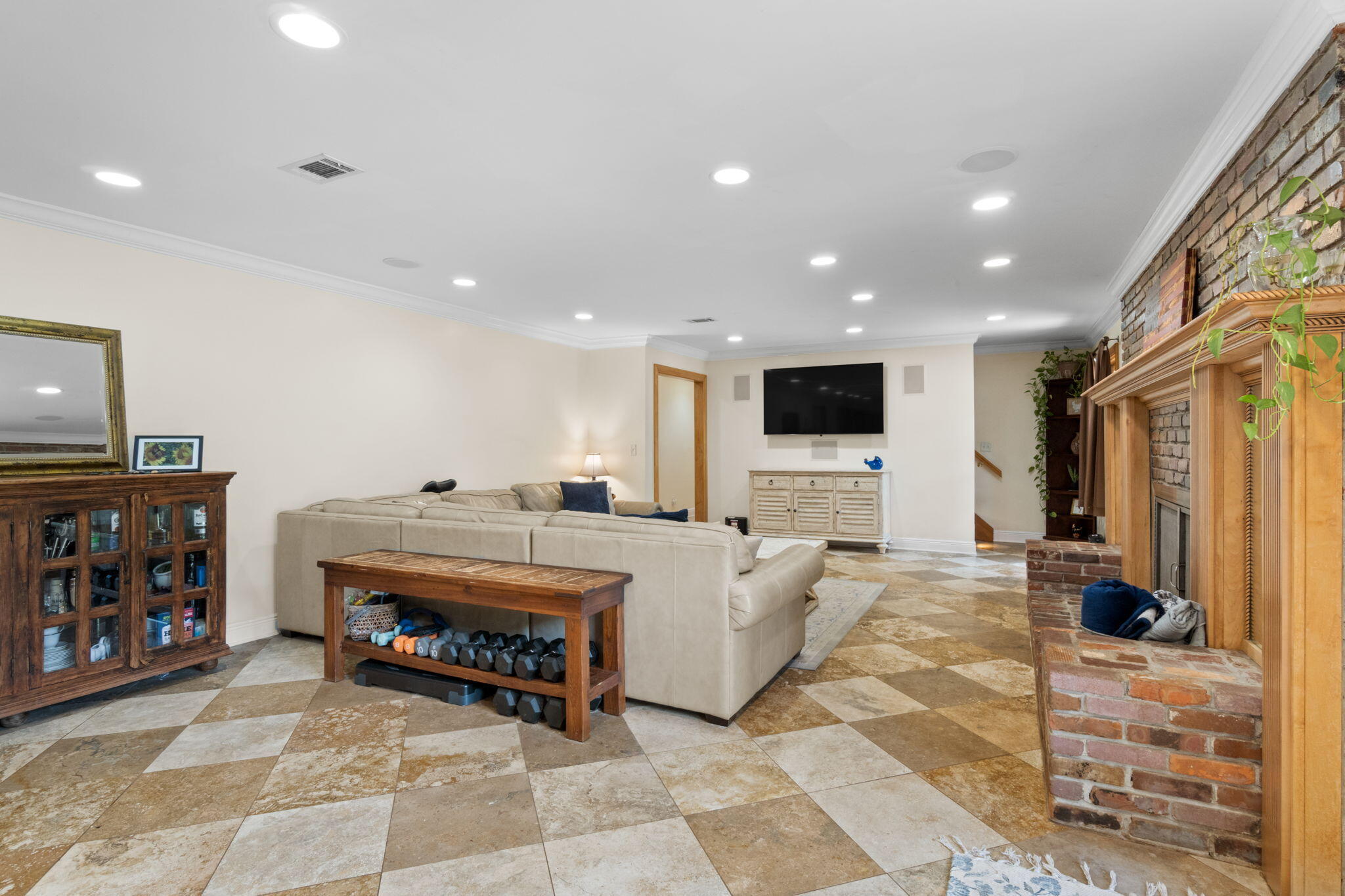 5750 Windham Road Milton, FL 32570 - Photo 43 of 77 a living room with furniture a flat screen tv and a fireplace