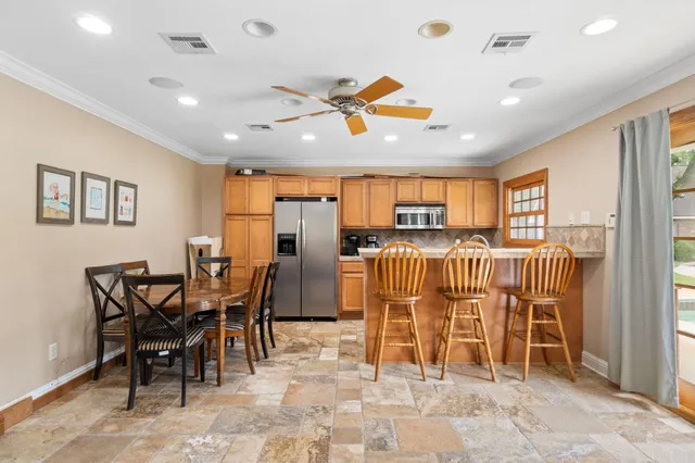 an aerial view of residential houses with outdoor space and swimming pool