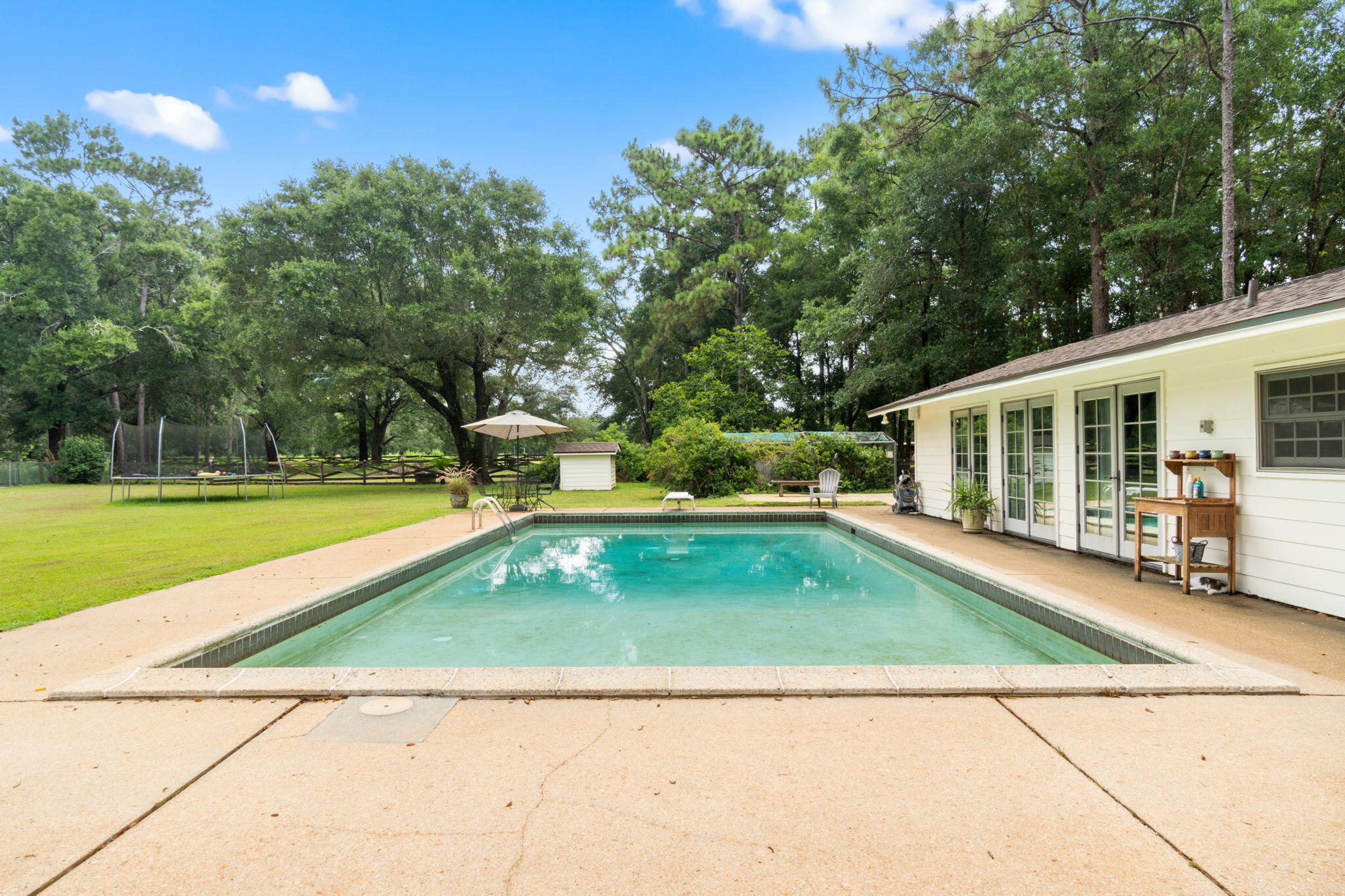 5750 Windham Road Milton, FL 32570 - Photo 54 of 77 a view of a swimming pool with a patio