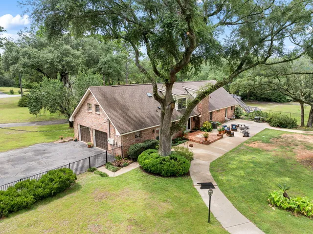 a view of a balcony with wooden floor