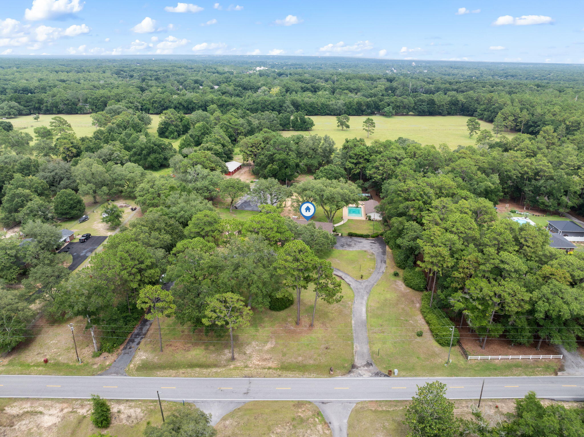 5750 Windham Road Milton, FL 32570 - Photo 71 of 77 an aerial view of residential houses with outdoor space and swimming pool
