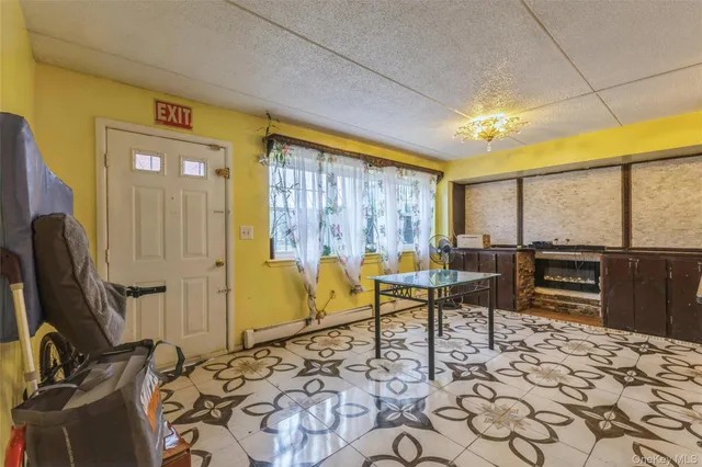 a view of a chairs in back yard of a building