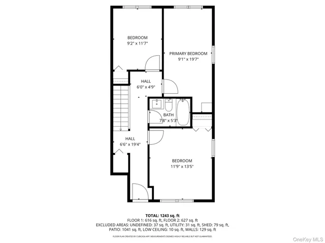 a picture of a bench in front of a wall