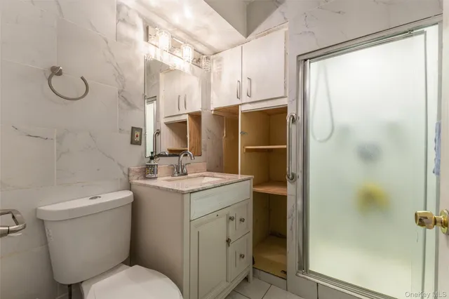 a view of a kitchen with a sink washer and dryer