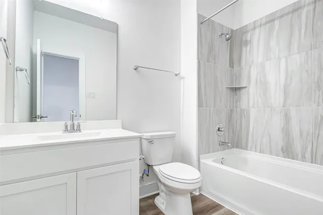 a bathroom with a sink a toilet and a bathtub