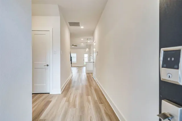 a view of a bathroom from the hallway