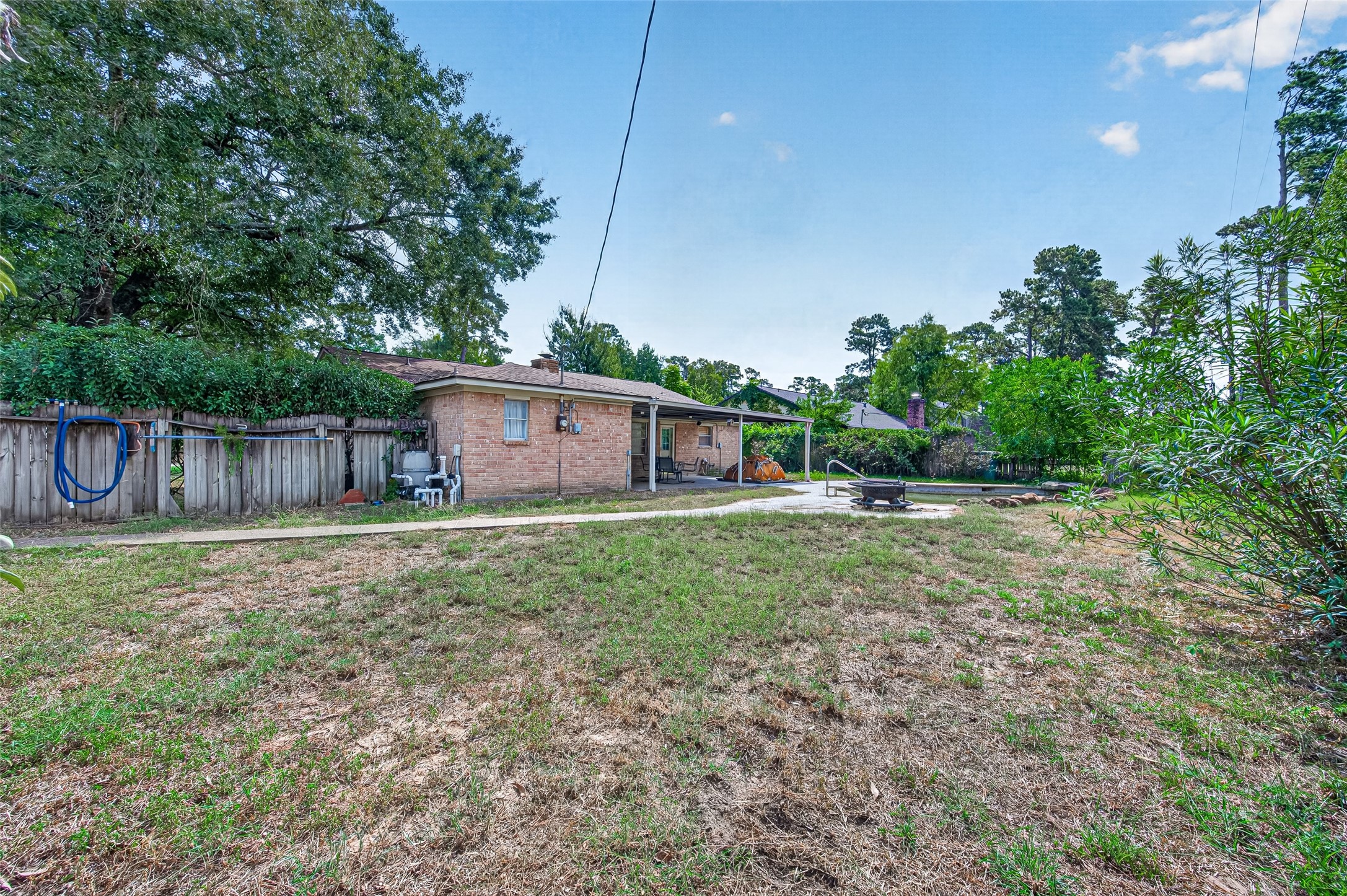10211 Kerr Lane Conroe, TX 77385 - Photo 44 of 45 Backyard with fire pit