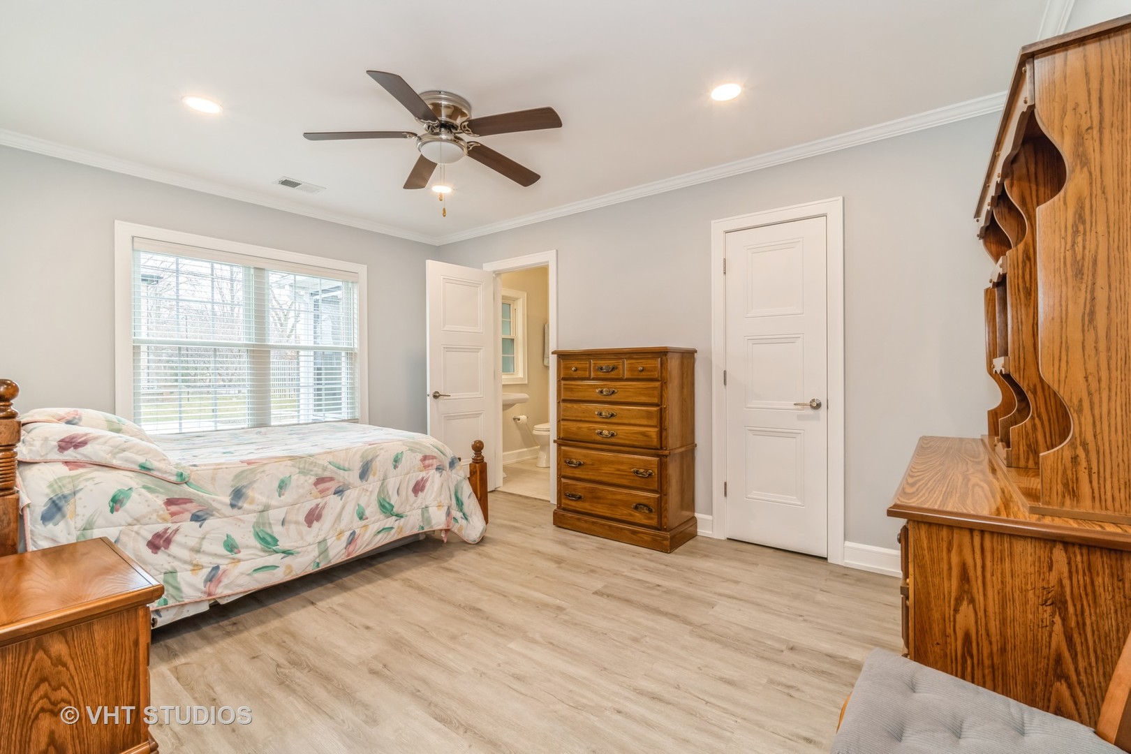711 Hunter Road Glenview, IL 60025 - Photo 6 of 12 a bedroom with a bed and wooden floor