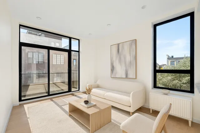a kitchen with stainless steel appliances granite countertop a sink and a refrigerator