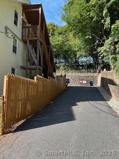 92 West Main Street Vernon, CT 06066 - Photo 13 of 14 a view of terrace with wooden floor and fence