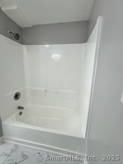 92 West Main Street Vernon, CT 06066 - Photo 4 of 14 a bathroom with a bathtub