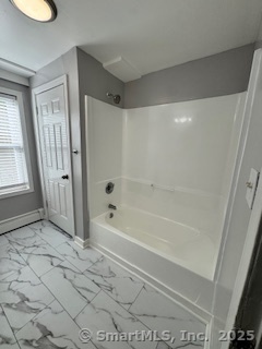 92 West Main Street Vernon, CT 06066 - Photo 5 of 14 a bathroom with a bathtub and a shower