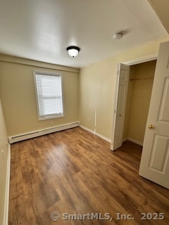 92 West Main Street Vernon, CT 06066 - Photo 7 of 14 an empty room with wooden floor and windows