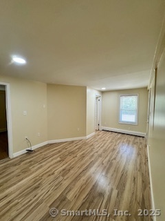 92 West Main Street Vernon, CT 06066 - Photo 8 of 14 a view of an empty room and wooden floor