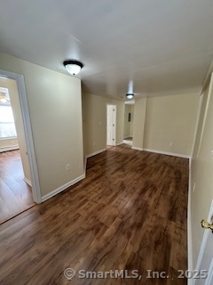 92 West Main Street Vernon, CT 06066 - Photo 9 of 14 a view of a big room with wooden floor and windows