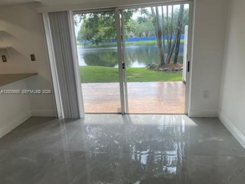 203 Riviera Circle, Unit 203 Weston, FL 33326 - Photo 12 of 30 a view of a small yard from a window