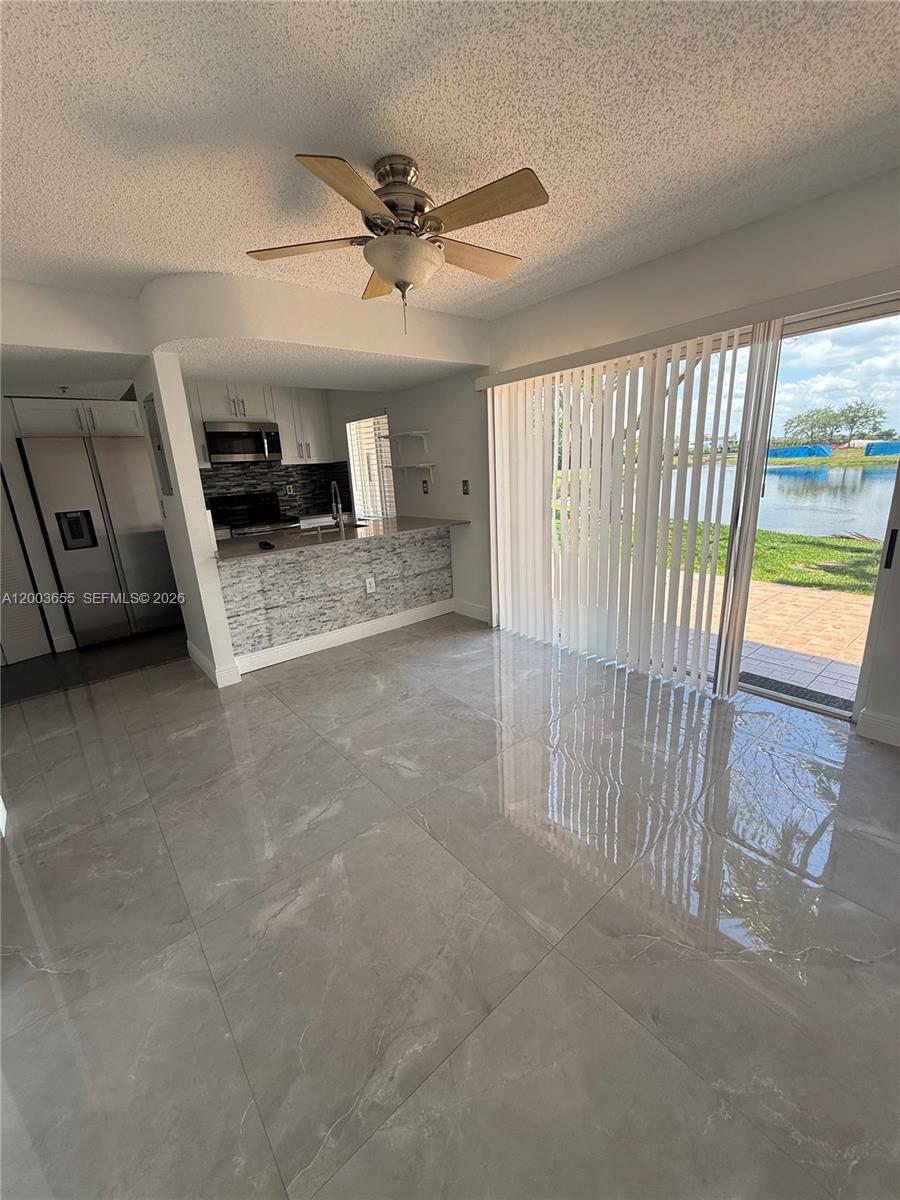 203 Riviera Circle, Unit 203 Weston, FL 33326 - Photo 13 of 30 a view of a livingroom with furniture