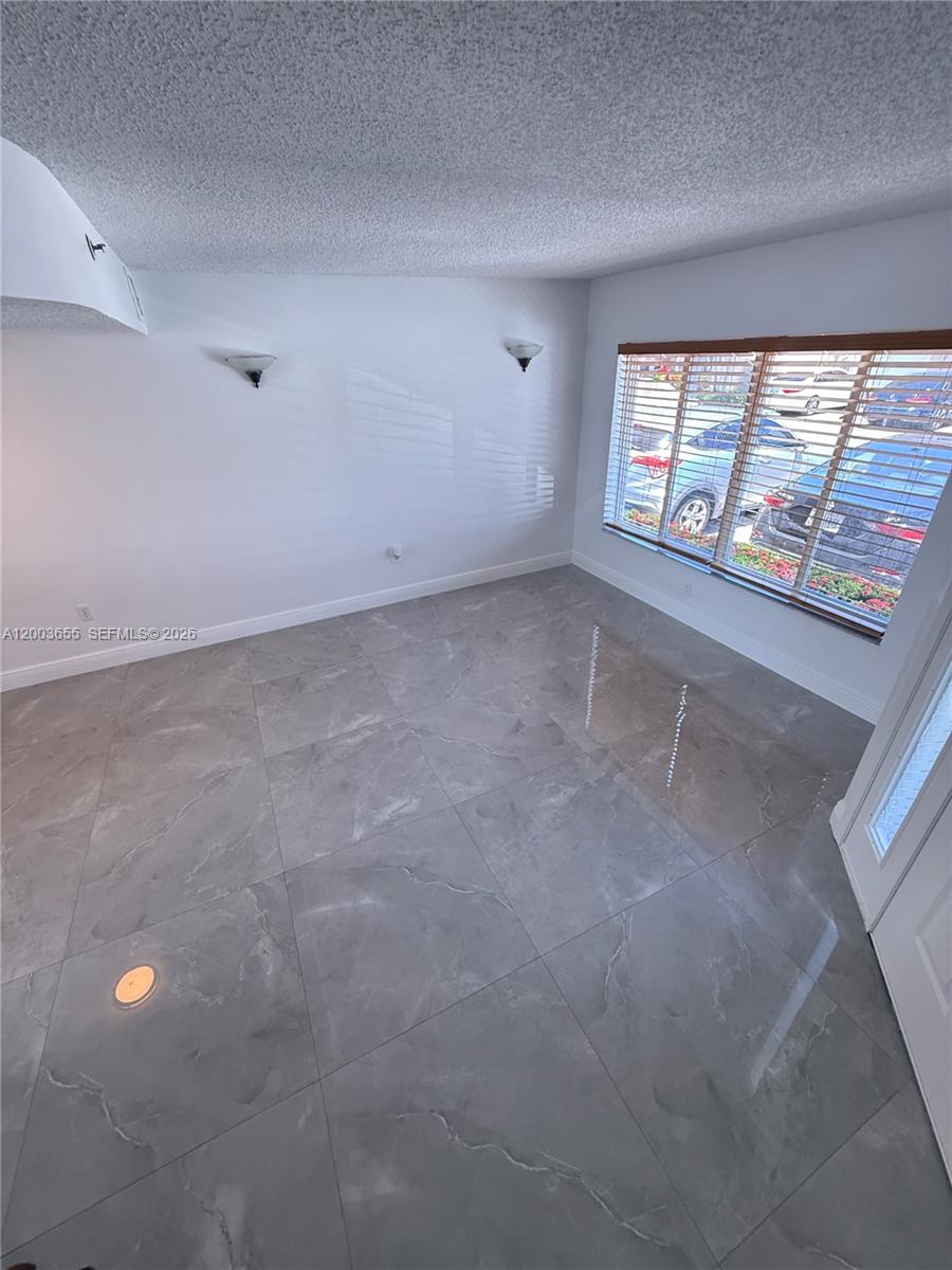 203 Riviera Circle, Unit 203 Weston, FL 33326 - Photo 16 of 30 an empty room with windows