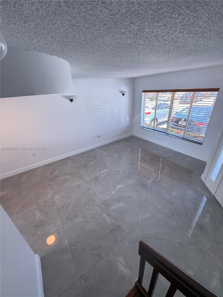 203 Riviera Circle, Unit 203 Weston, FL 33326 - Photo 17 of 30 en empty room with windows