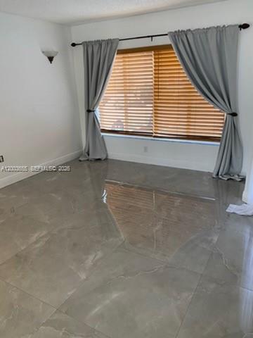 203 Riviera Circle, Unit 203 Weston, FL 33326 - Photo 19 of 30 an empty room with a window