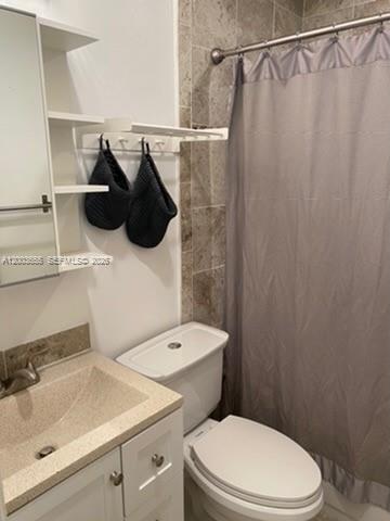 203 Riviera Circle, Unit 203 Weston, FL 33326 - Photo 21 of 30 a bathroom with a sink and toilet