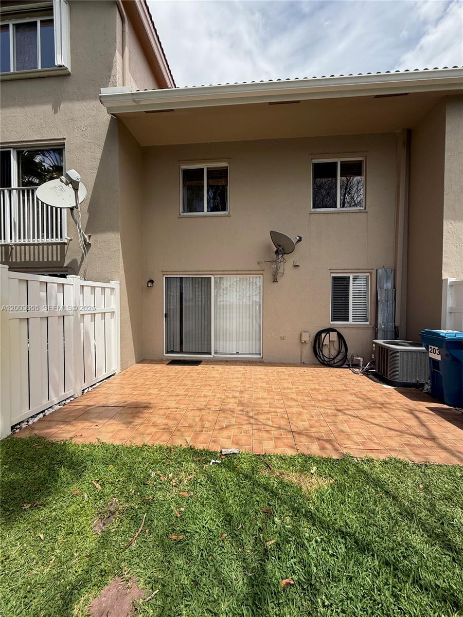 203 Riviera Circle, Unit 203 Weston, FL 33326 - Photo 28 of 30 a house view with a backyard space