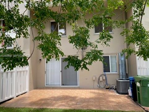 203 Riviera Circle, Unit 203 Weston, FL 33326 - Photo 29 of 30 a front view of a house with garden