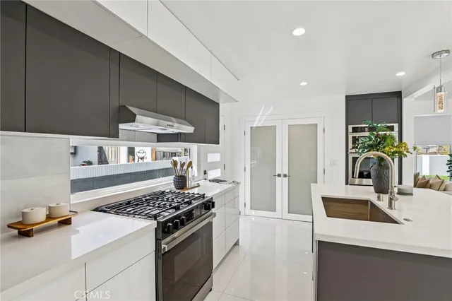 a kitchen with a stove and a refrigerator
