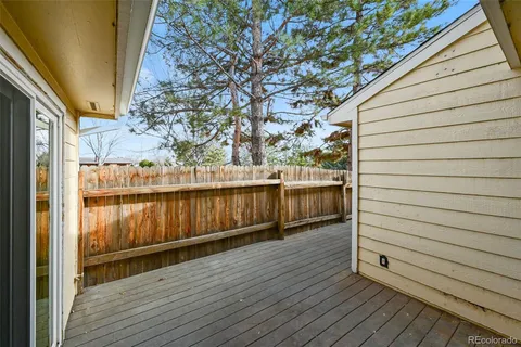 a view of a balcony with wooden floor