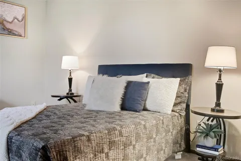 a bed room with a bed and a lamp