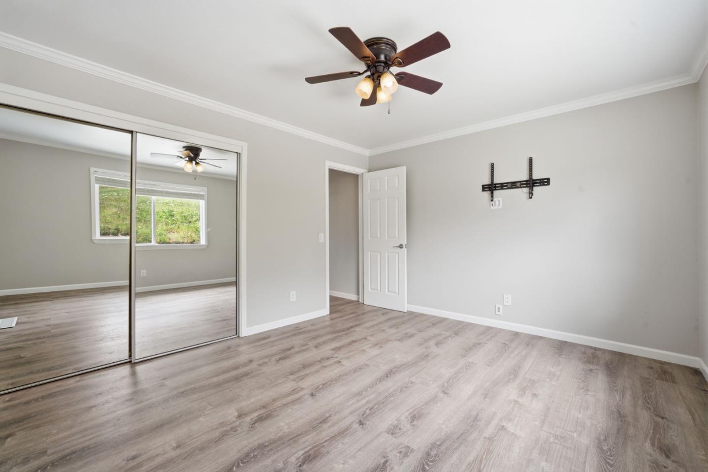 10867 Assisi Way Salinas, CA 93907 - Photo 13 of 35 an empty room with fan and windows