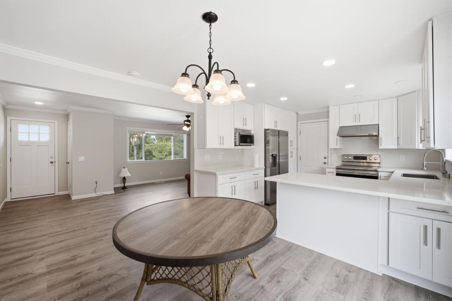 10867 Assisi Way Salinas, CA 93907 - Photo 30 of 35 a living room with stainless steel appliances kitchen island granite countertop furniture and a kitchen view