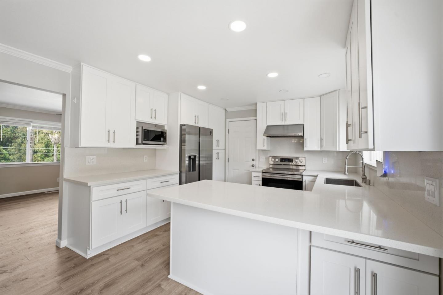 10867 Assisi Way Salinas, CA 93907 - Photo 32 of 35 a kitchen with stainless steel appliances a refrigerator sink and microwave