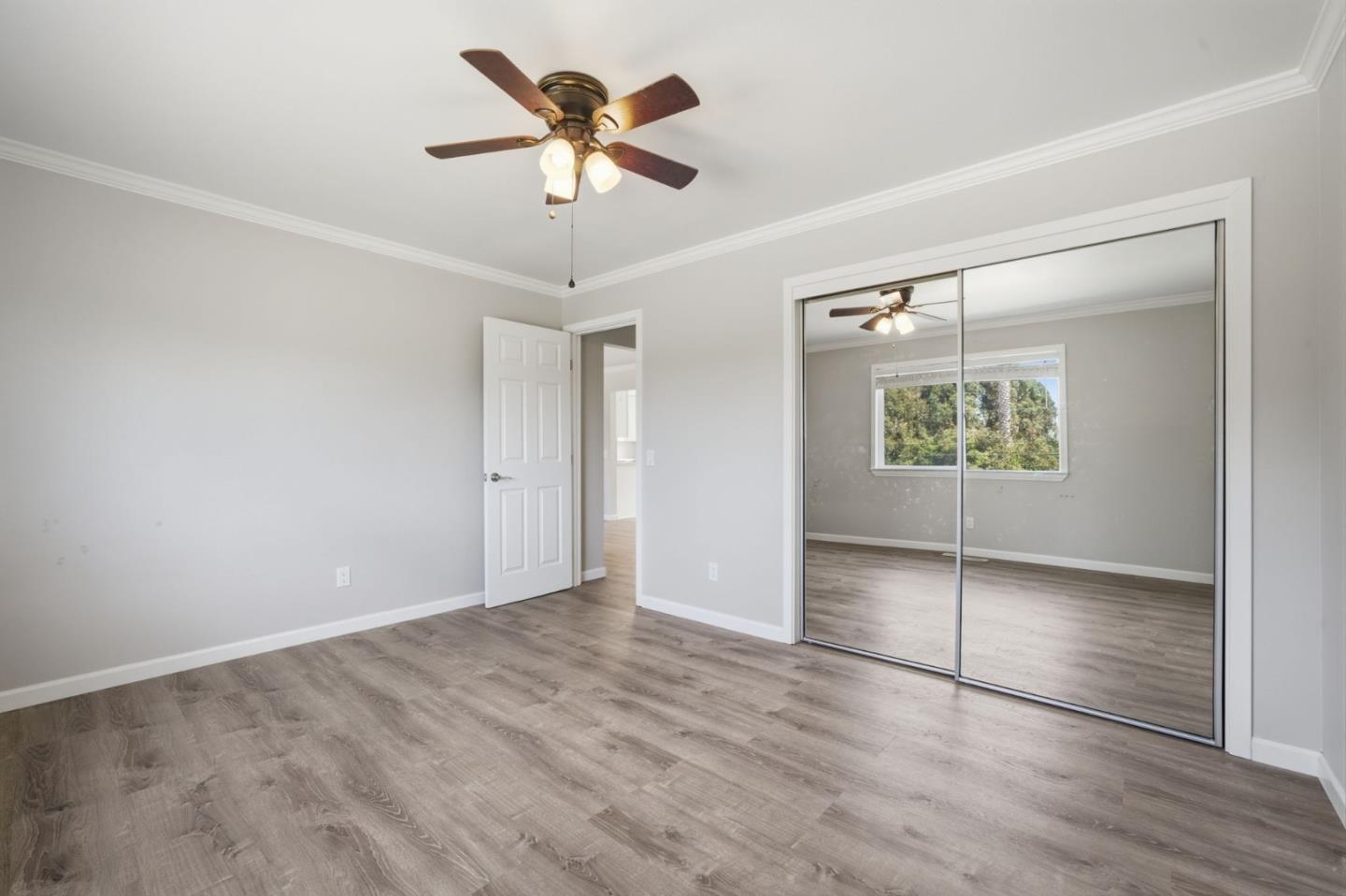 10867 Assisi Way Salinas, CA 93907 - Photo 10 of 35 an empty room with windows and fan
