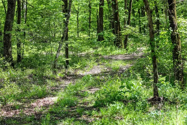 a view of a house with backyard wooden deck and sitting area