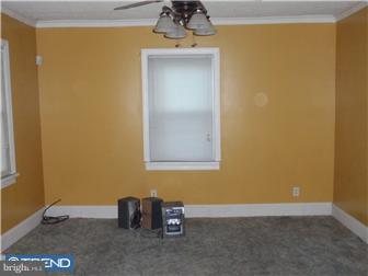 410 Filmore Street Riverside, NJ 08075 - Photo 3 of 11 a view of an empty room with a window