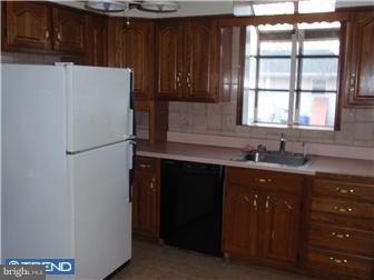 410 Filmore Street Riverside, NJ 08075 - Photo 5 of 11 a kitchen with a refrigerator and window