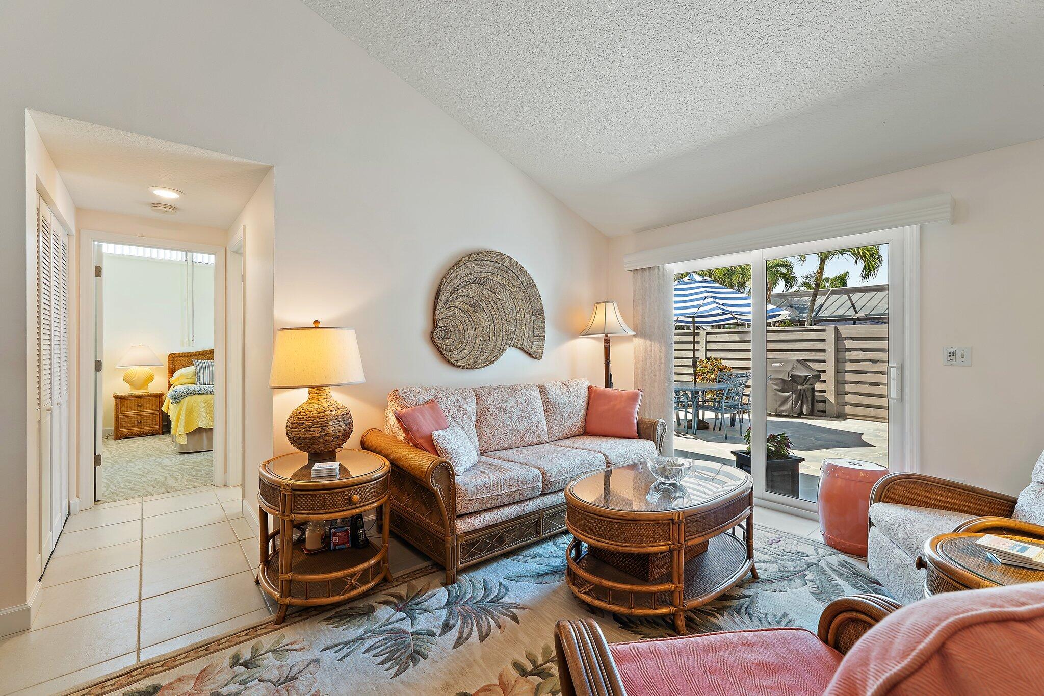 1801 South Us Highway, Unit 8D Jupiter, FL 33477 - Photo 11 of 36 a living room with furniture a rug and a large window