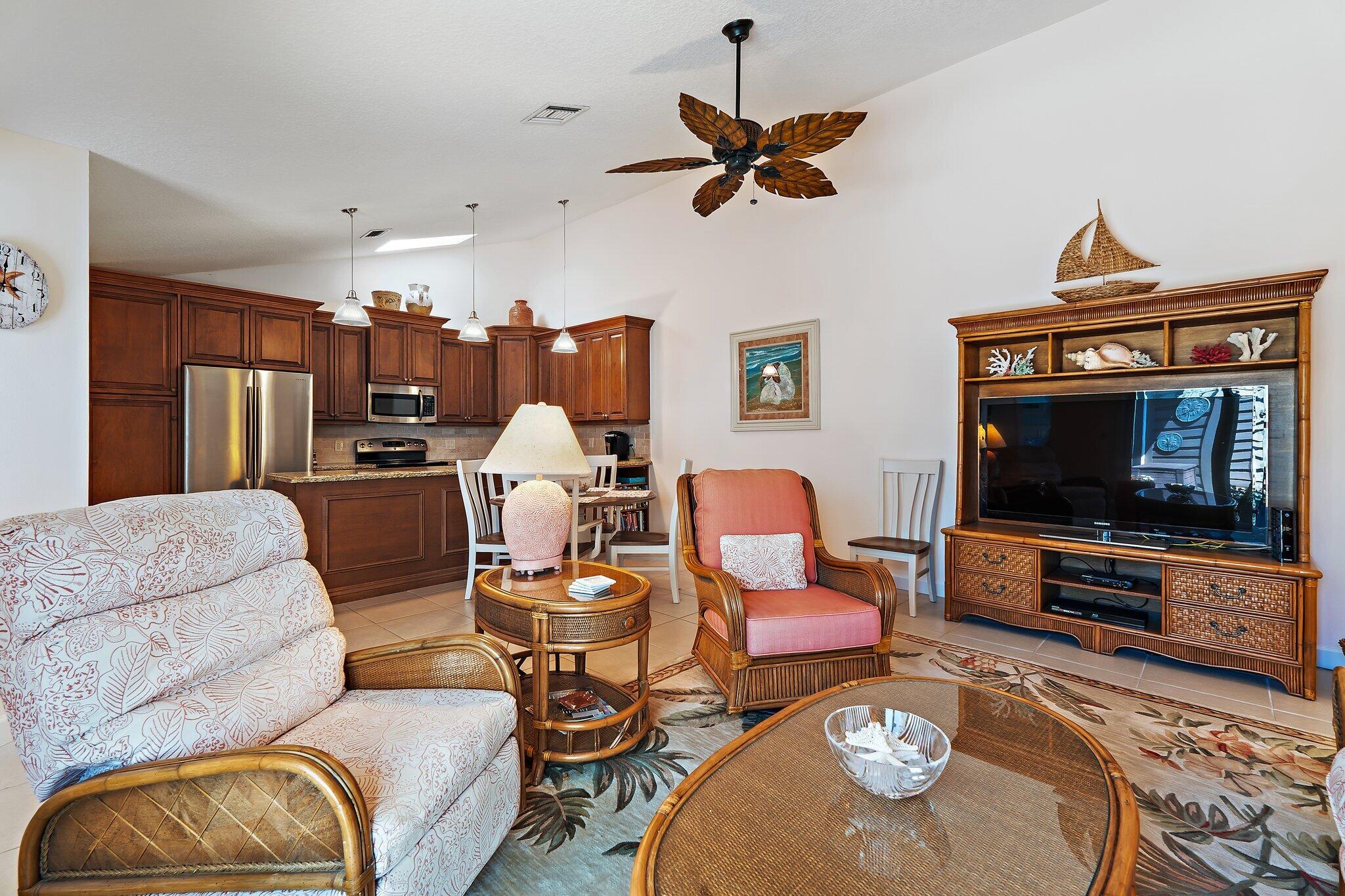 1801 South Us Highway, Unit 8D Jupiter, FL 33477 - Photo 13 of 36 a living room with furniture and a flat screen tv