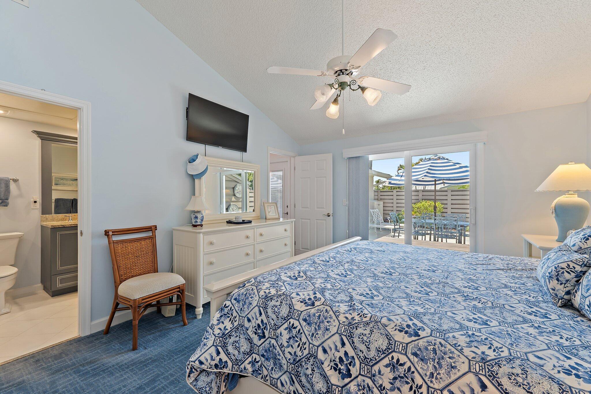 1801 South Us Highway, Unit 8D Jupiter, FL 33477 - Photo 15 of 36 a bedroom with a bed a couch and dresser