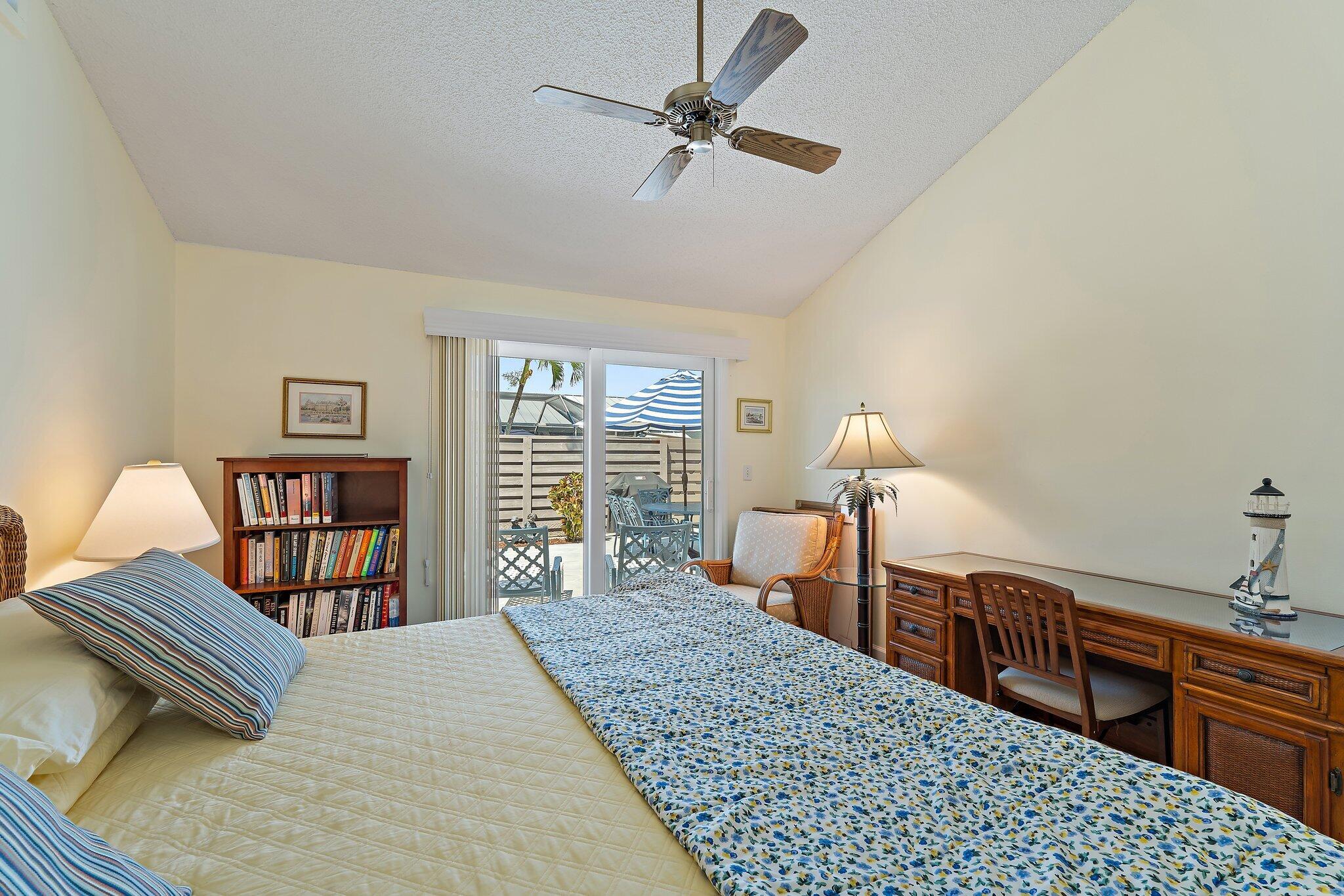1801 South Us Highway, Unit 8D Jupiter, FL 33477 - Photo 19 of 36 a bed room with a bed and a chandelier