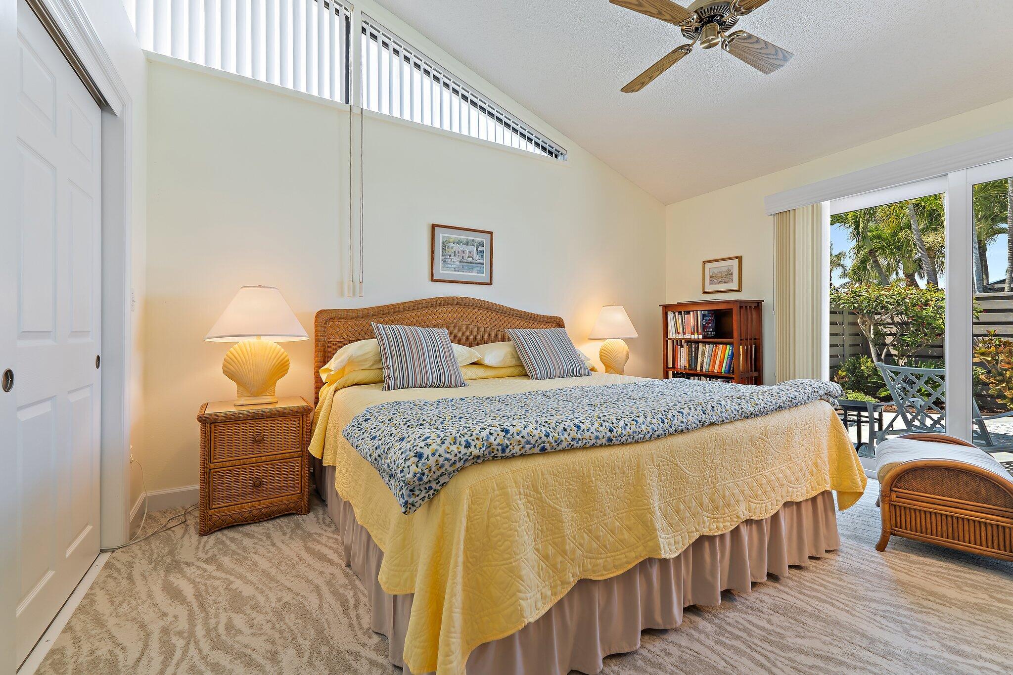 1801 South Us Highway, Unit 8D Jupiter, FL 33477 - Photo 20 of 36 a bedroom with a bed and window