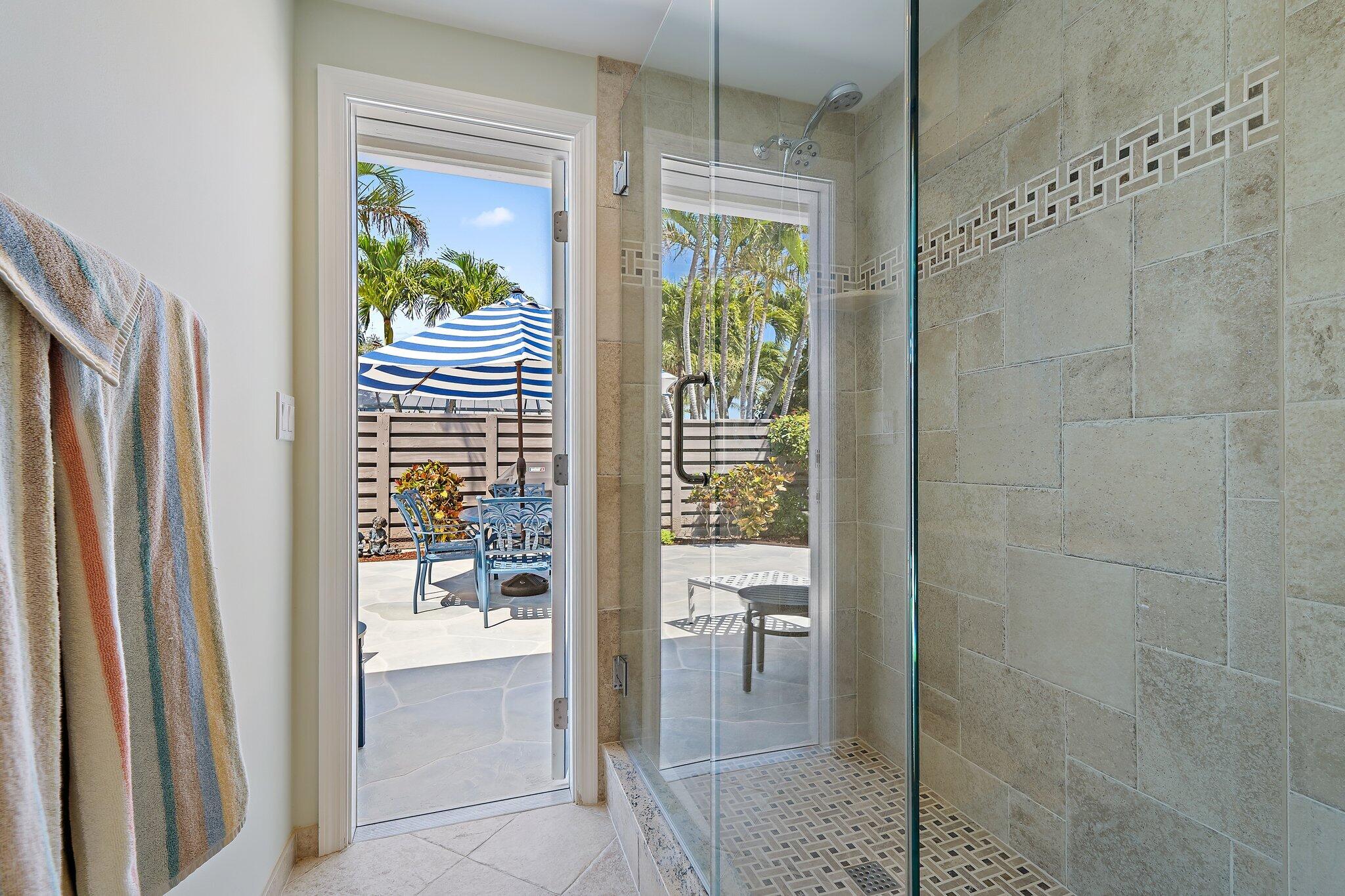 1801 South Us Highway, Unit 8D Jupiter, FL 33477 - Photo 22 of 36 a bathroom with a shower and a sink