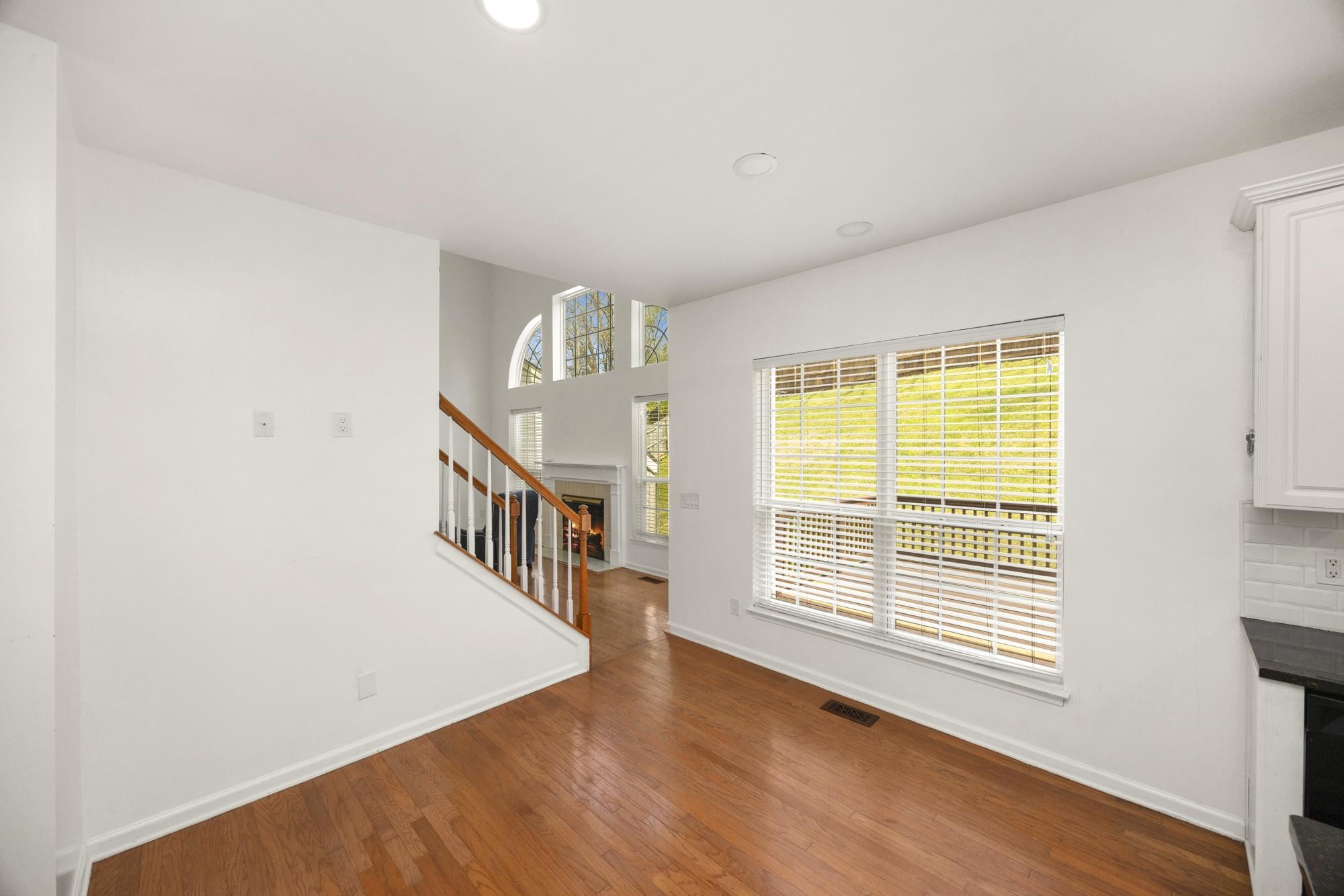 513 Cold Stream Place Nashville, TN 37221 - Photo 12 of 40 a view of an empty room with wooden floor and a window