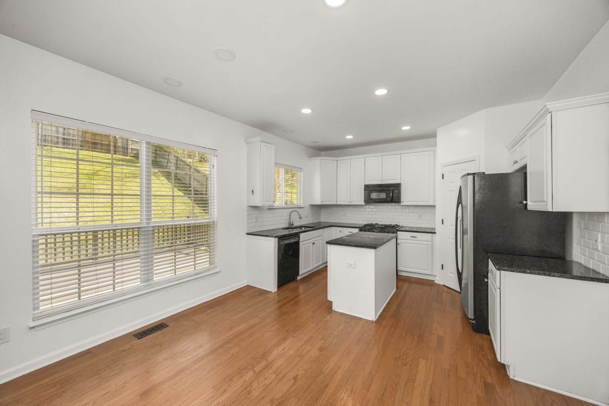 513 Cold Stream Place Nashville, TN 37221 - Photo 13 of 40 a kitchen with a refrigerator and a stove top oven