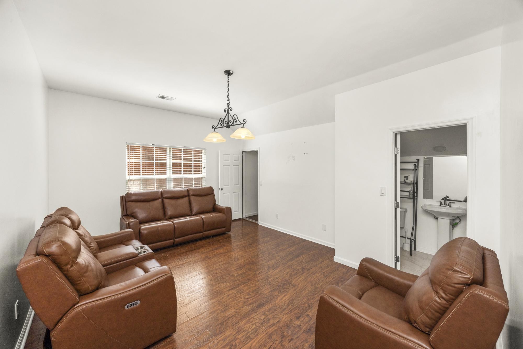 513 Cold Stream Place Nashville, TN 37221 - Photo 29 of 40 a living room with furniture ceiling fan and a wooden floor
