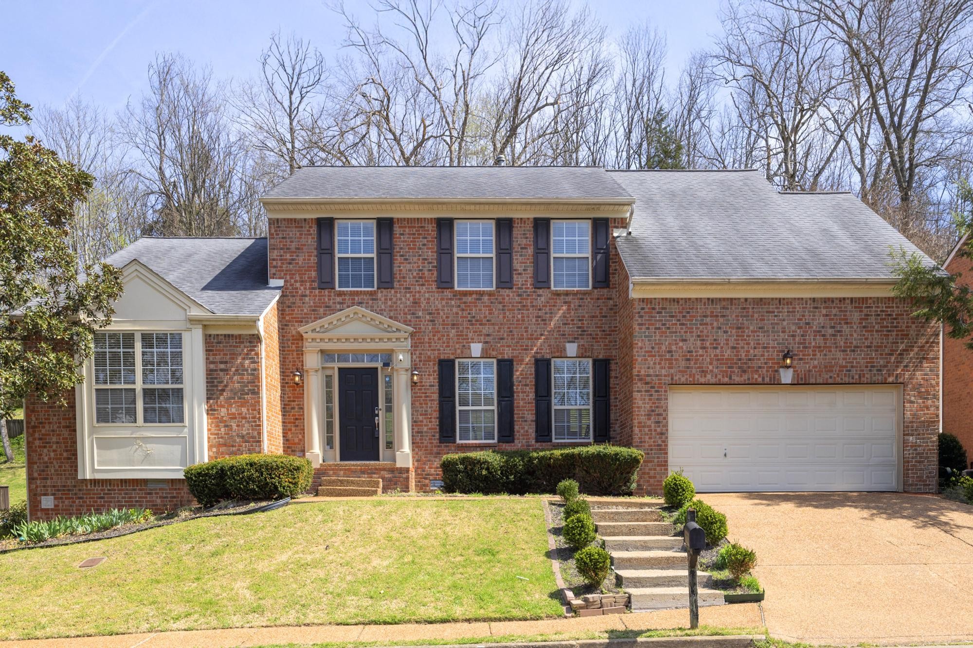513 Cold Stream Place Nashville, TN 37221 - Photo 3 of 40 a front view of a house with yard and parking