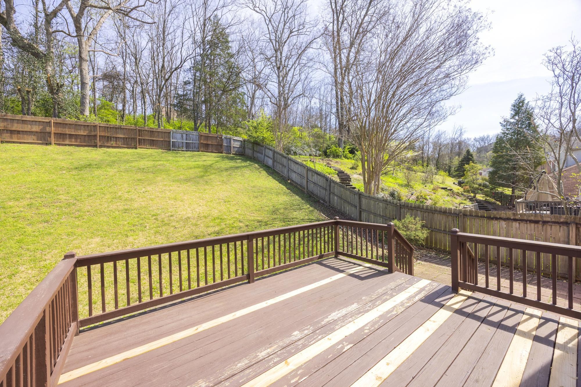 513 Cold Stream Place Nashville, TN 37221 - Photo 32 of 40 a view of a swimming pool with a patio and wooden deck