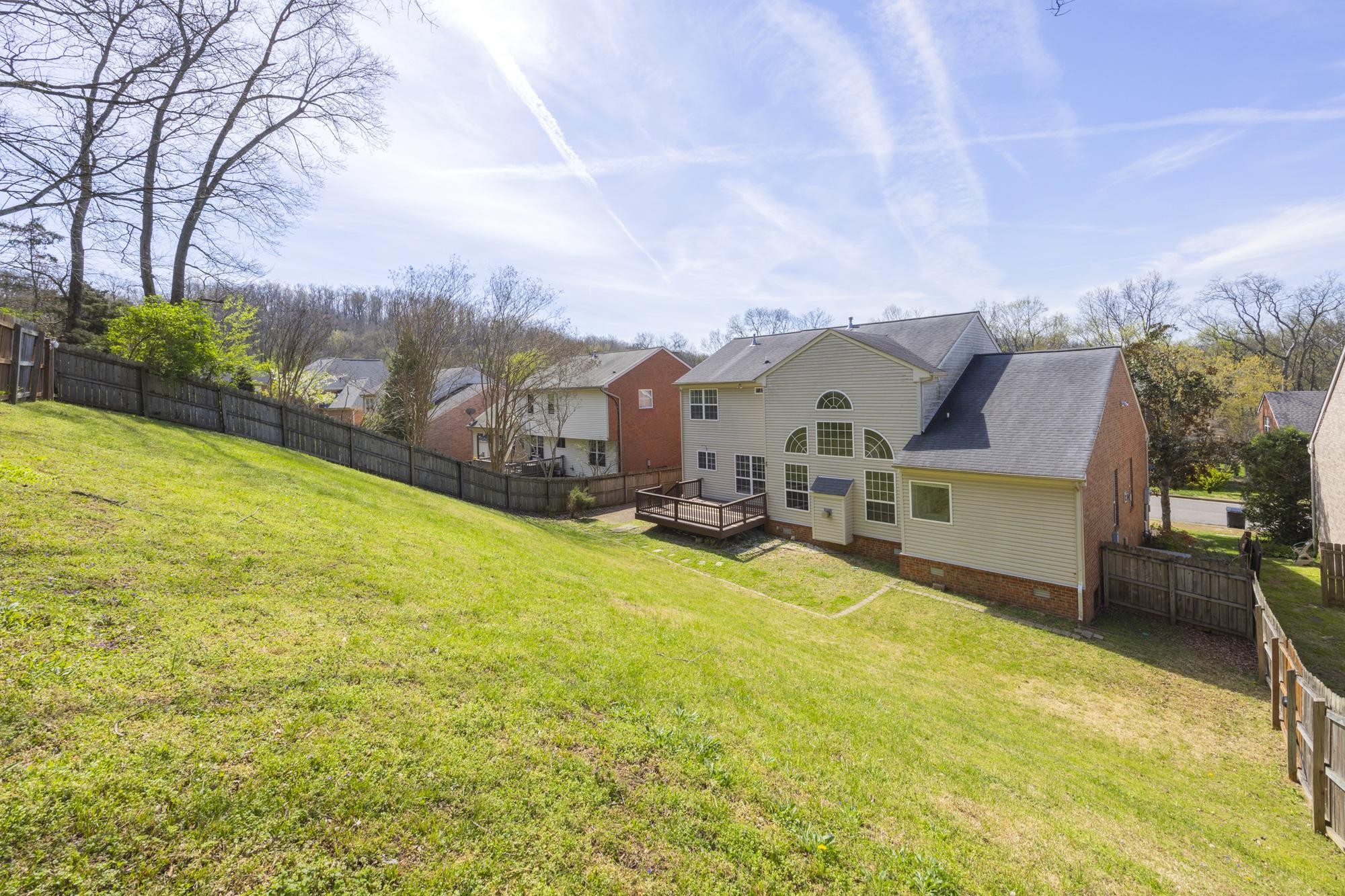 513 Cold Stream Place Nashville, TN 37221 - Photo 38 of 40 a view of a house with a big yard next to a building