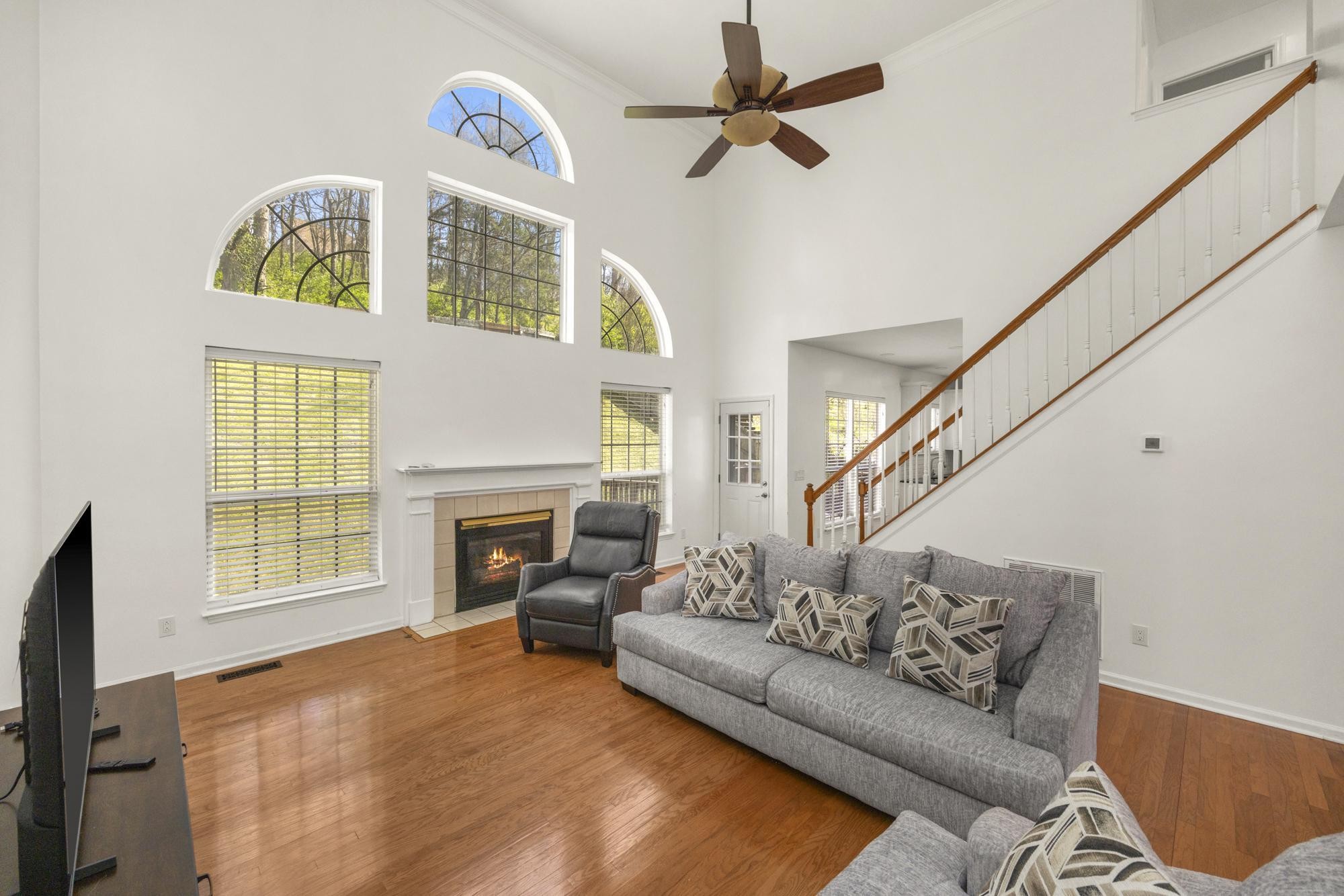 513 Cold Stream Place Nashville, TN 37221 - Photo 7 of 40 a living room with furniture a fireplace and a flat screen tv